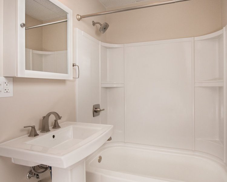 Interior view of the renovated 2-bedroom rental apartment at 19 Warsaw Ave in Mechanicville, NY located in a historic building with modern finishes.