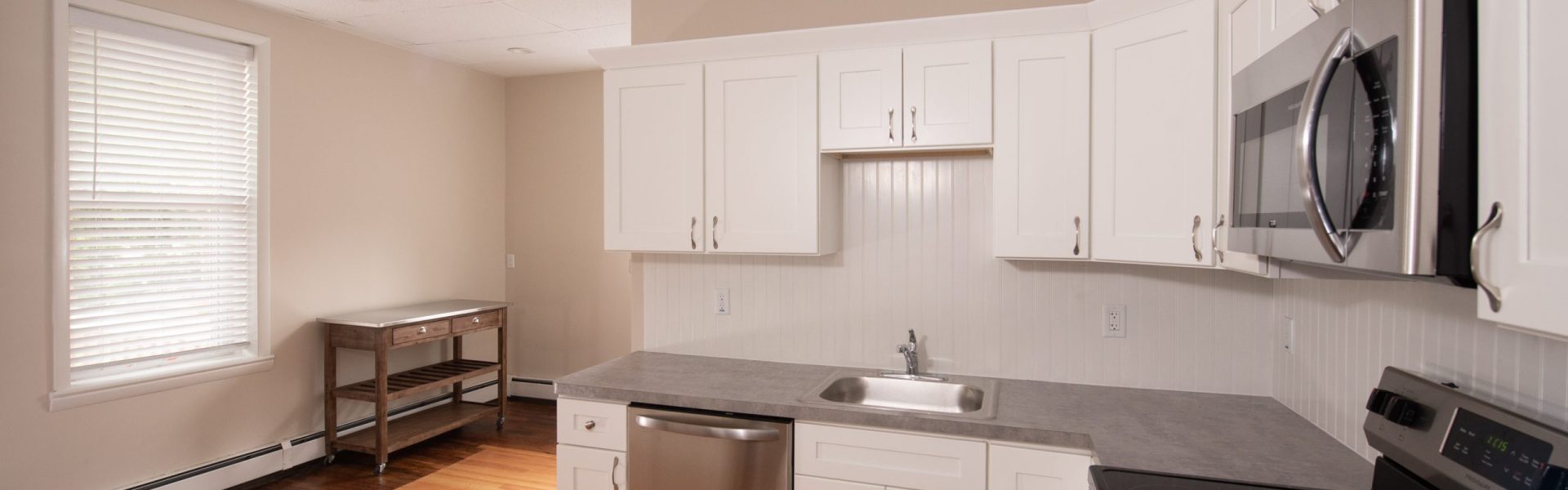 Interior view of a renovated 2-bedroom rental apartment at 19 Warsaw Ave in Mechanicville, NY located inside a historic building with updated finishes.