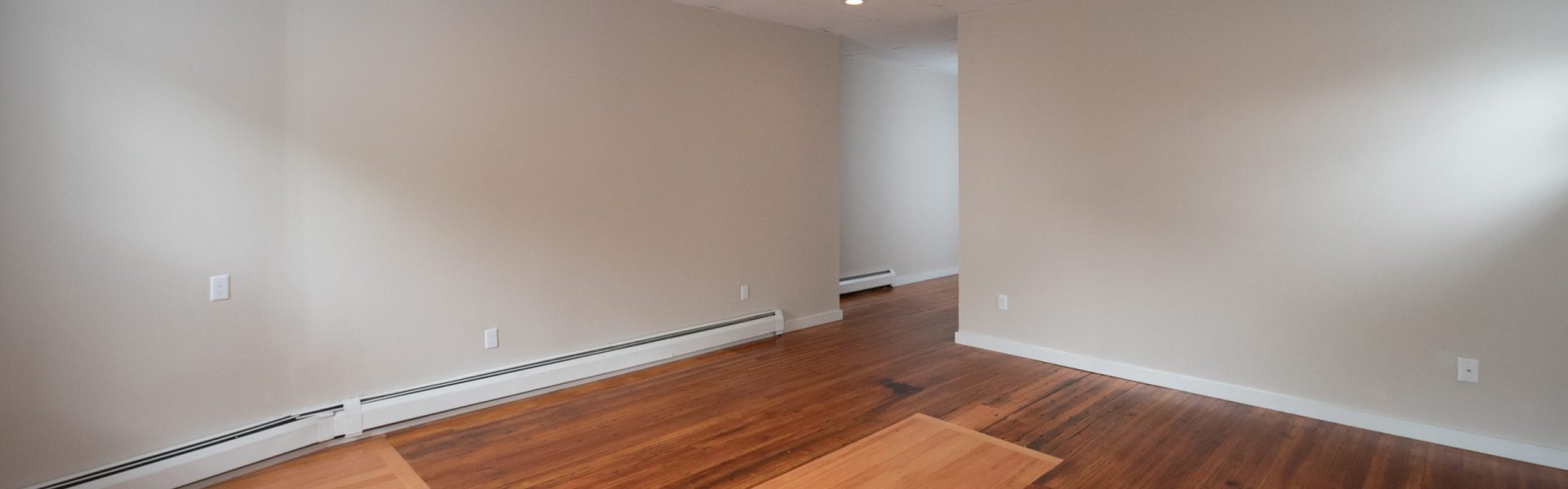 Interior view of a renovated 2-bedroom rental apartment at 19 Warsaw Ave in Mechanicville, NY located inside a historic building with updated finishes.