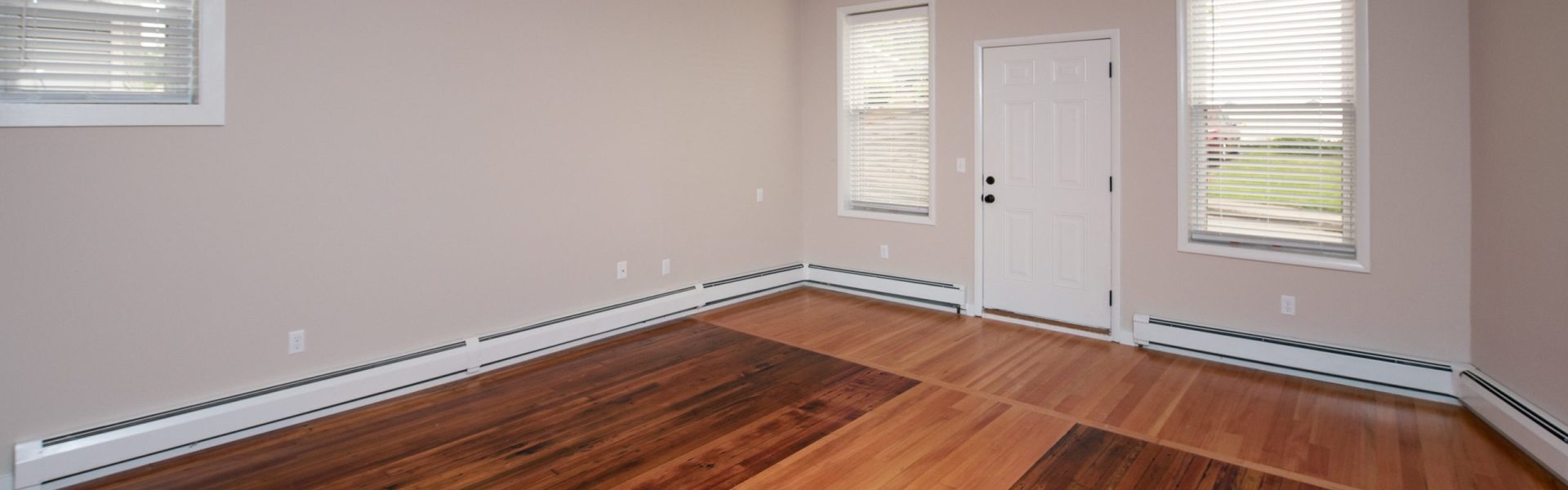 Interior view of a renovated 2-bedroom rental apartment at 19 Warsaw Ave in Mechanicville, NY located inside a historic building with updated finishes.
