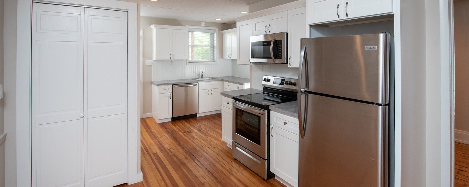 Interior view of the renovated 2-bedroom rental apartment at 19 Warsaw Ave in Mechanicville, NY located in a historic building with modern finishes.