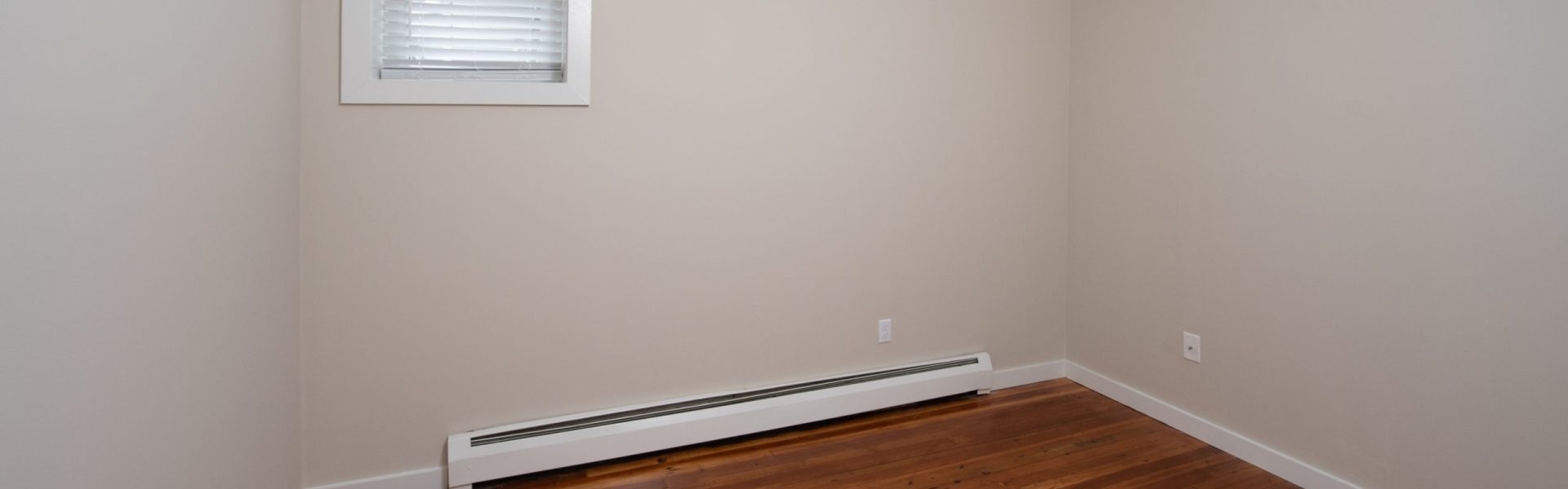 Interior view of a renovated 2-bedroom rental apartment at 19 Warsaw Ave in Mechanicville, NY located inside a historic building with updated finishes.