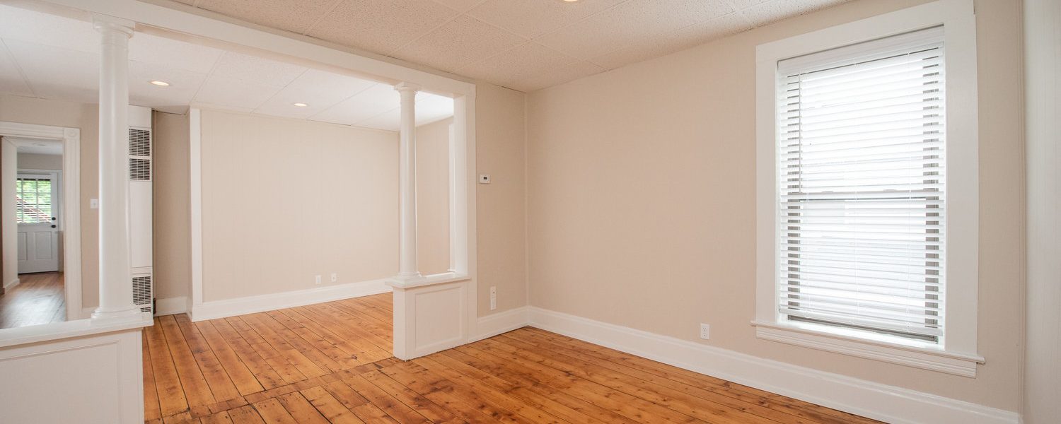 Interior view of the renovated 2-bedroom rental apartment at 19 Warsaw Ave in Mechanicville, NY located in a historic building with modern finishes.