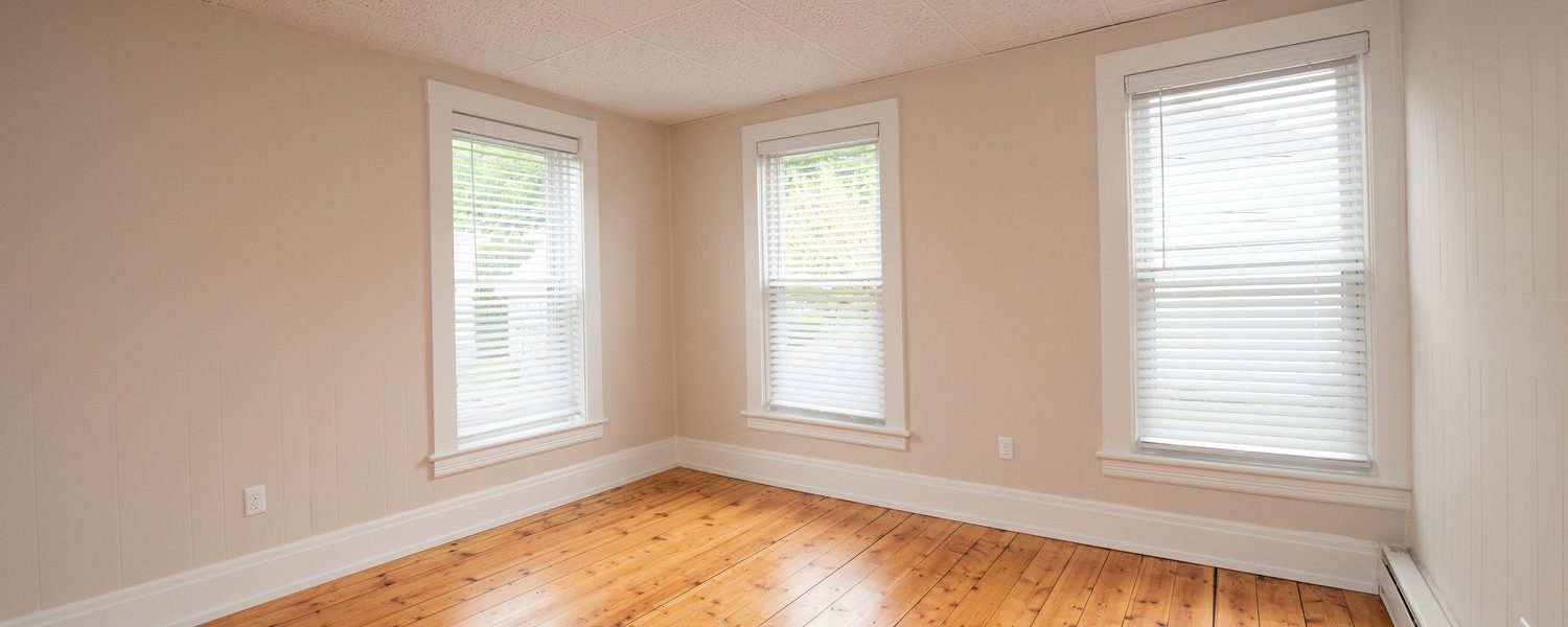 Interior view of the renovated 2-bedroom rental apartment at 19 Warsaw Ave in Mechanicville, NY located in a historic building with modern finishes.