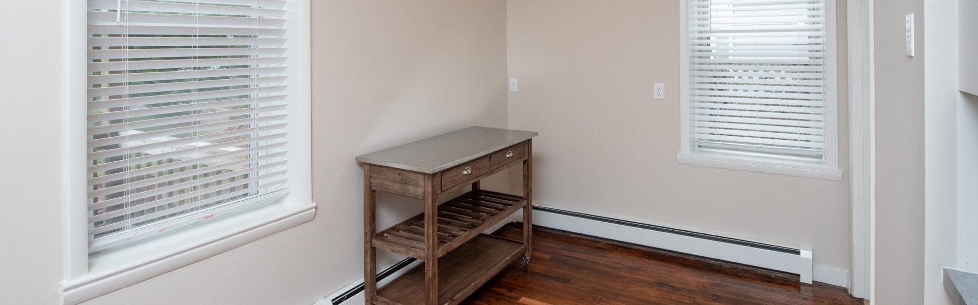 Interior view of a renovated 2-bedroom rental apartment at 19 Warsaw Ave in Mechanicville, NY located inside a historic building with updated finishes.