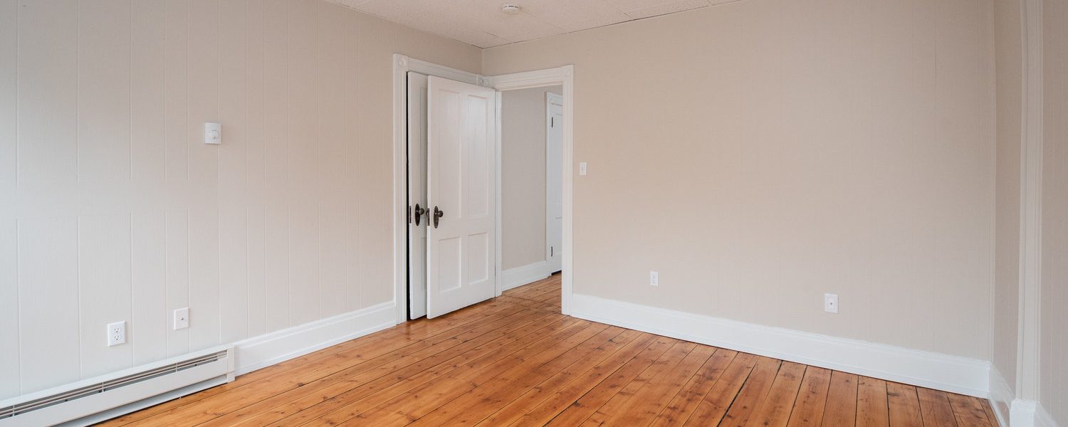 Interior view of the renovated 2-bedroom rental apartment at 19 Warsaw Ave in Mechanicville, NY located in a historic building with modern finishes.