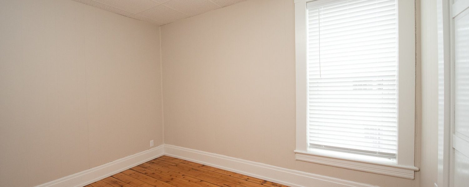Interior view of the renovated 2-bedroom rental apartment at 19 Warsaw Ave in Mechanicville, NY located in a historic building with modern finishes.