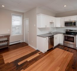 Interior view of a renovated 2-bedroom rental apartment at 19 Warsaw Ave in Mechanicville, NY located inside a historic building with updated finishes.