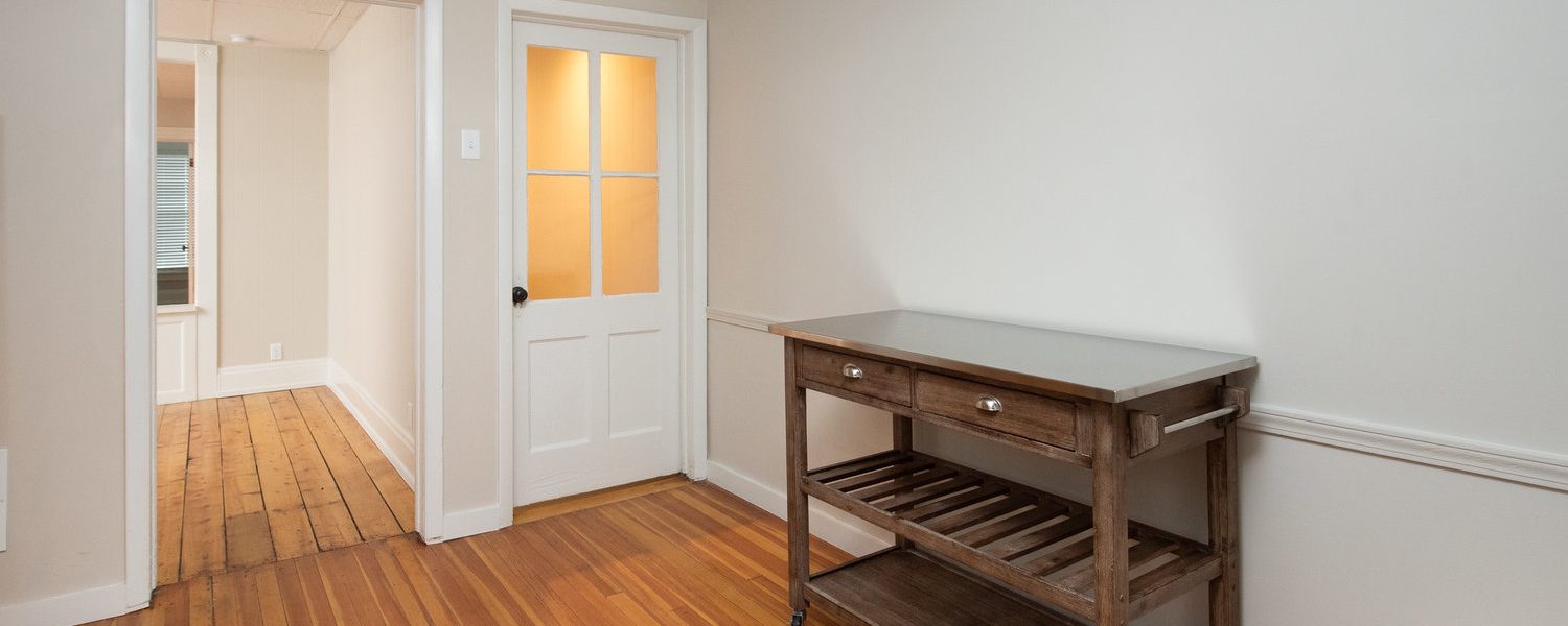 Interior view of the renovated 2-bedroom rental apartment at 19 Warsaw Ave in Mechanicville, NY located in a historic building with modern finishes.