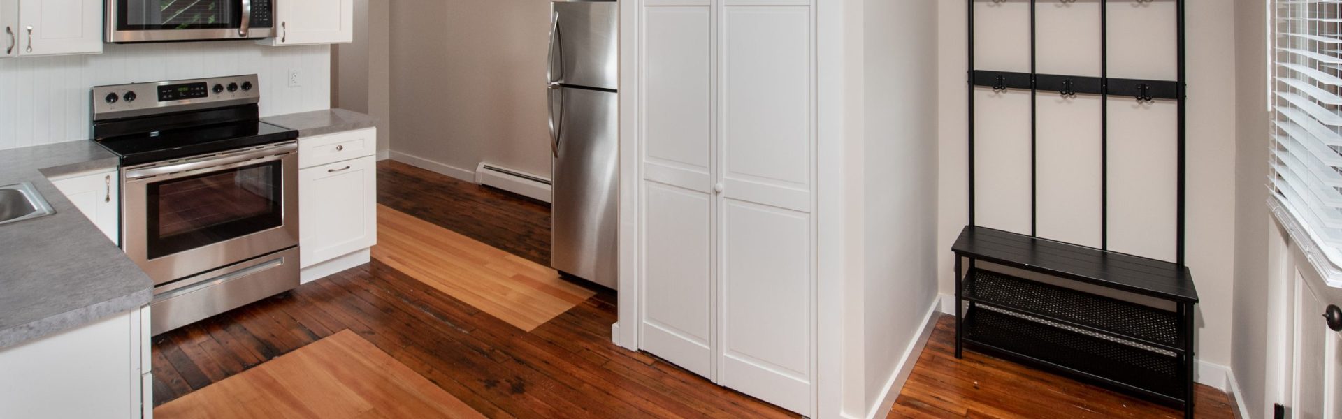 Interior view of a renovated 2-bedroom rental apartment at 19 Warsaw Ave in Mechanicville, NY located inside a historic building with updated finishes.