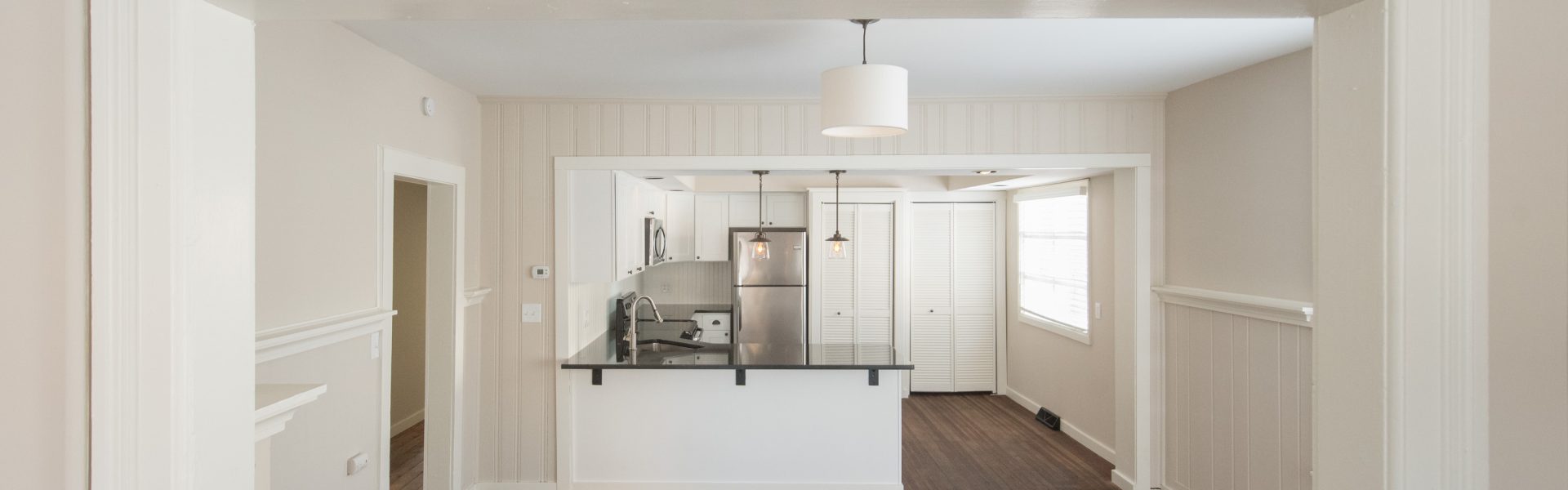 Interior and exterior views of the inviting 2-bedroom apartment at 130 Van Dam St #1 in downtown Saratoga Springs, NY featuring a private entrance and architectural details.