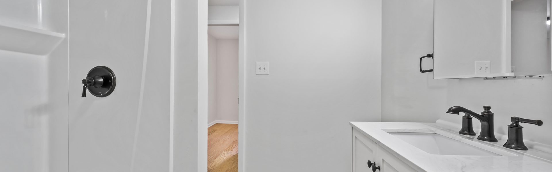 Interior view of a modern 2-bedroom plus office rental apartment at 42-44 Saratoga Ave #3W in Mechanicville, NY featuring updated finishes and a dedicated workspace.