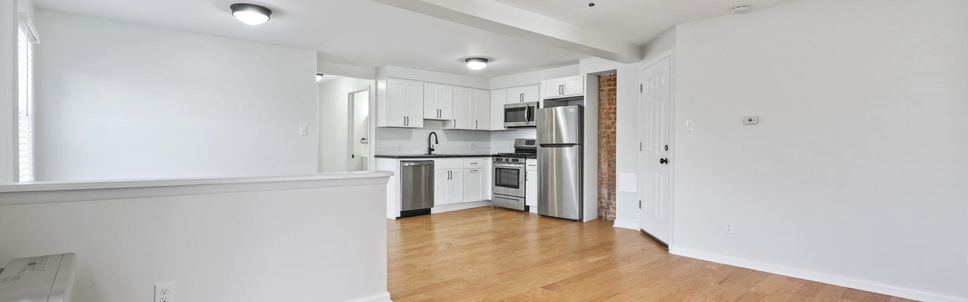 Interior view of a modern 2-bedroom plus office rental apartment at 42-44 Saratoga Ave #3W in Mechanicville, NY featuring updated finishes and a dedicated workspace.