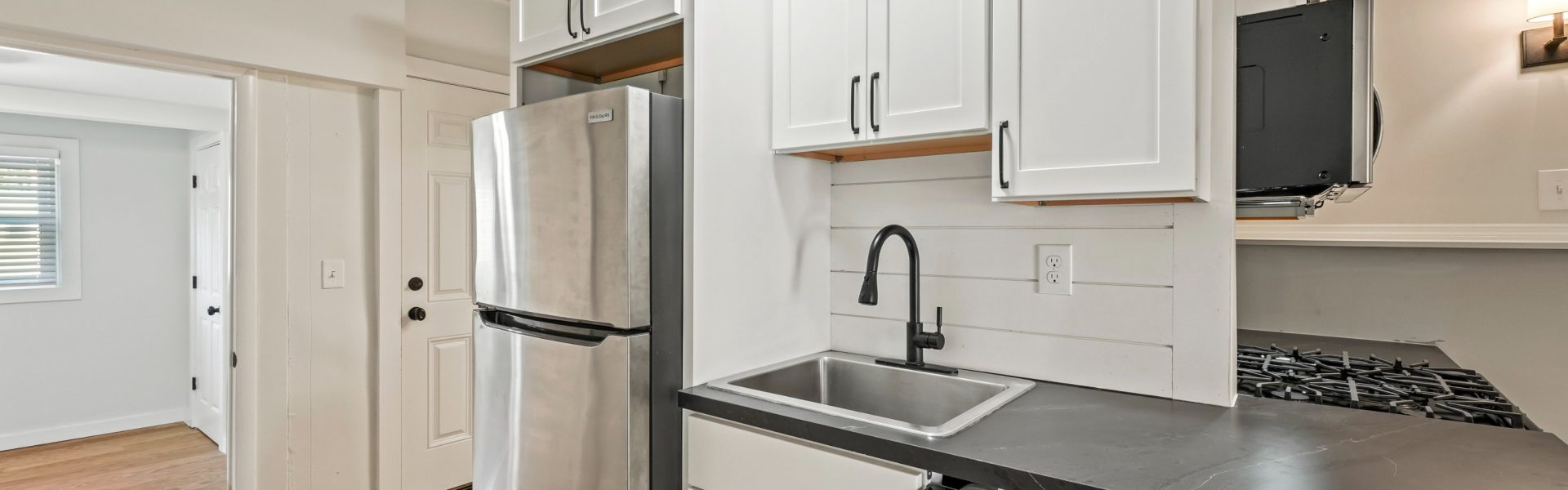 Interior view of the modern 2-bedroom rental apartment at 42-44 Saratoga Ave #2W in Mechanicville, NY featuring updated finishes and spacious living areas.