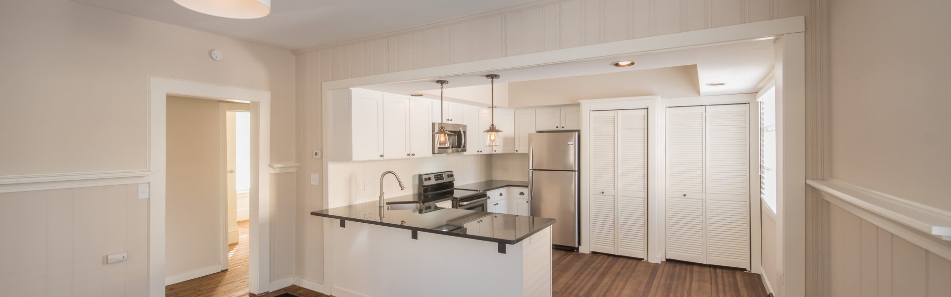 Interior and exterior views of the inviting 2-bedroom apartment at 130 Van Dam St #1 in downtown Saratoga Springs, NY featuring a private entrance and architectural details.