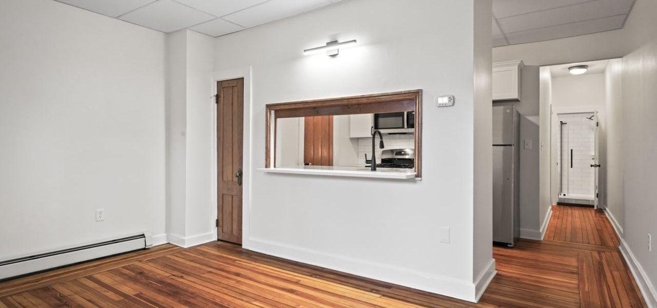 Interior view of a warm and stylish 1-bedroom apartment at 33 Franklin St #2 in downtown Saratoga Springs, NY with updated finishes and walkable access to shops and dining.
