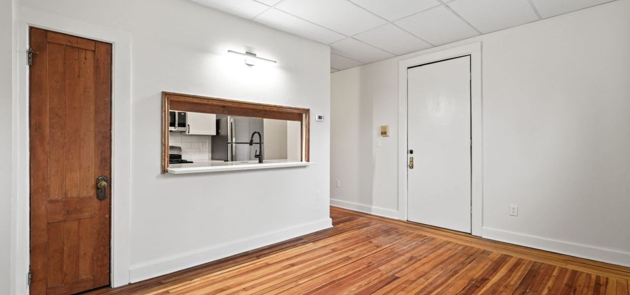 Interior view of a warm and stylish 1-bedroom apartment at 33 Franklin St #2 in downtown Saratoga Springs, NY with updated finishes and walkable access to shops and dining.