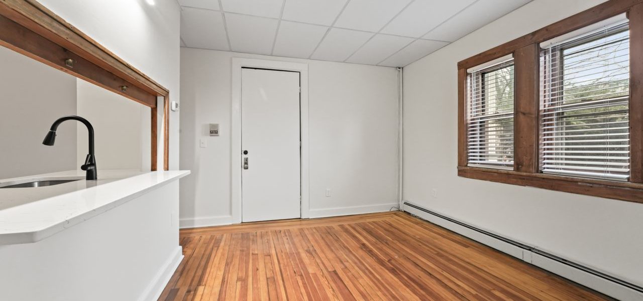 Interior view of a warm and stylish 1-bedroom apartment at 33 Franklin St #2 in downtown Saratoga Springs, NY with updated finishes and walkable access to shops and dining.