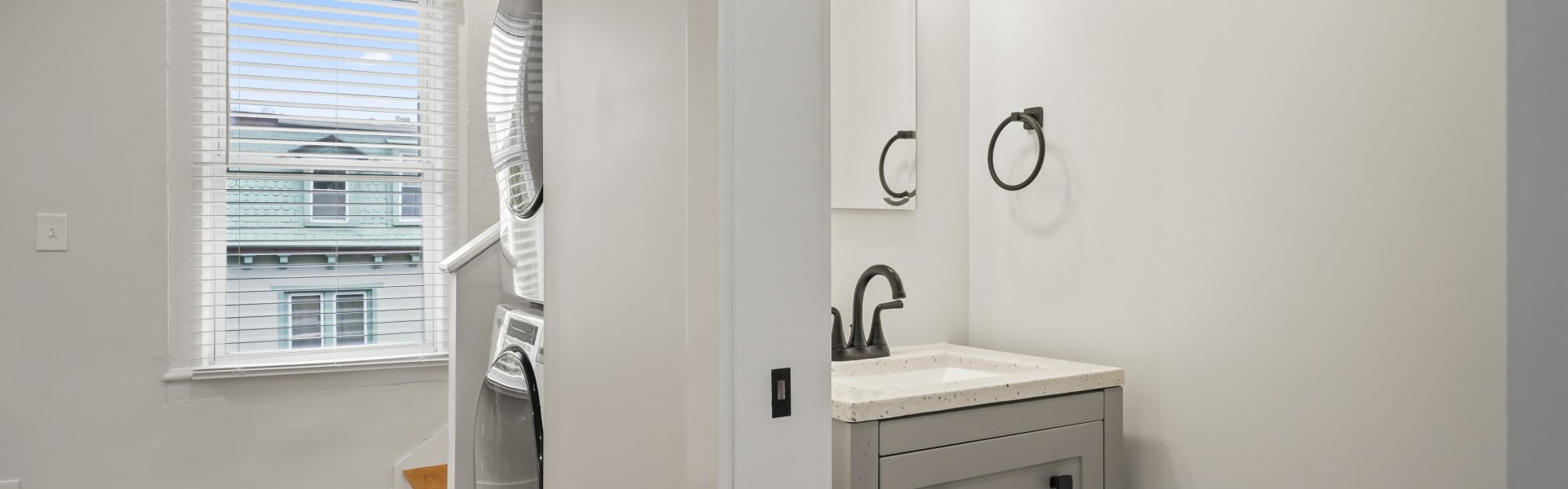 Interior view of a newly renovated 2-bedroom apartment at 58 Lincoln Ave #2 in Saratoga Springs, NY, featuring a balcony, dedicated office space, and modern finishes.