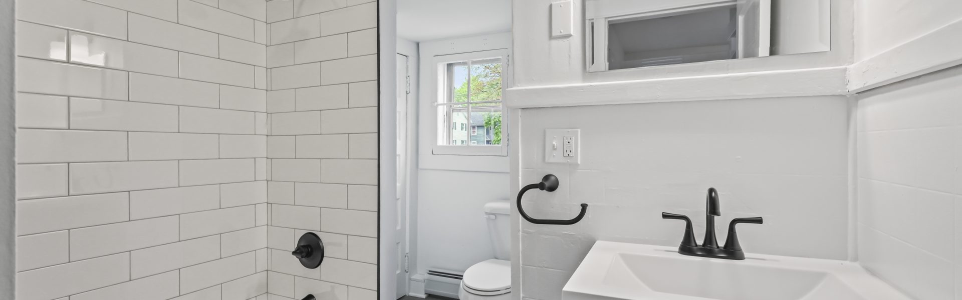 Interior view of a newly renovated 1-bedroom apartment at 2 New St #3 in South Glens Falls, NY with updated flooring and modern finishes.
