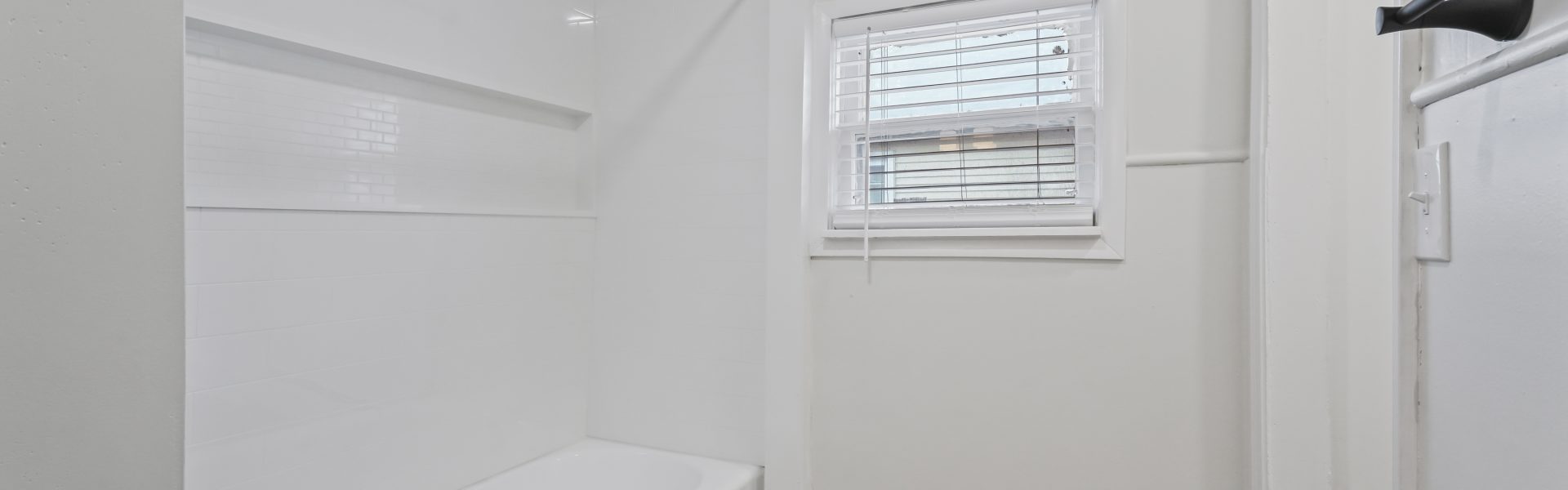 Interior view of a newly renovated 1-bedroom apartment at 2 New St #4 in South Glens Falls, NY, featuring updated flooring, modern finishes, and bright natural light.