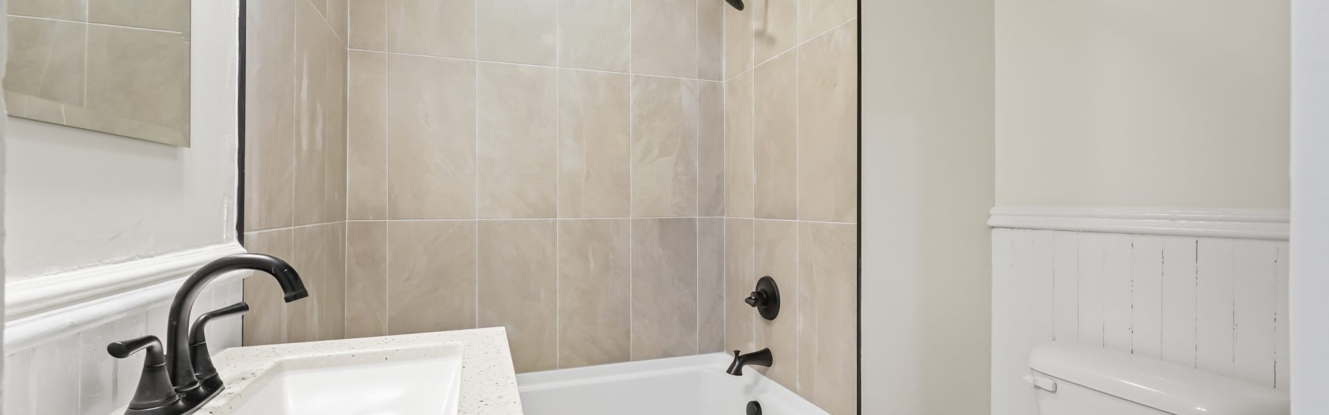 Interior view of a newly renovated 2-bedroom apartment at 58 Lincoln Ave #2 in Saratoga Springs, NY, featuring a balcony, dedicated office space, and modern finishes.