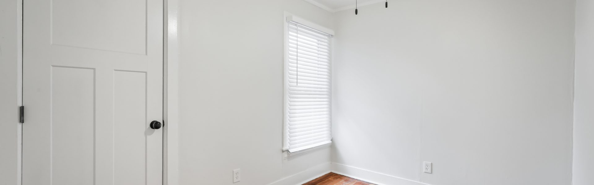 Interior view of a newly renovated 2-bedroom apartment at 58 Lincoln Ave #2 in Saratoga Springs, NY, featuring a balcony, dedicated office space, and modern finishes.