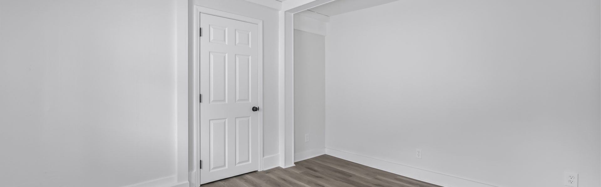 Interior view of a newly renovated 1-bedroom apartment at 2 New St #4 in South Glens Falls, NY, featuring updated flooring, modern finishes, and bright natural light.