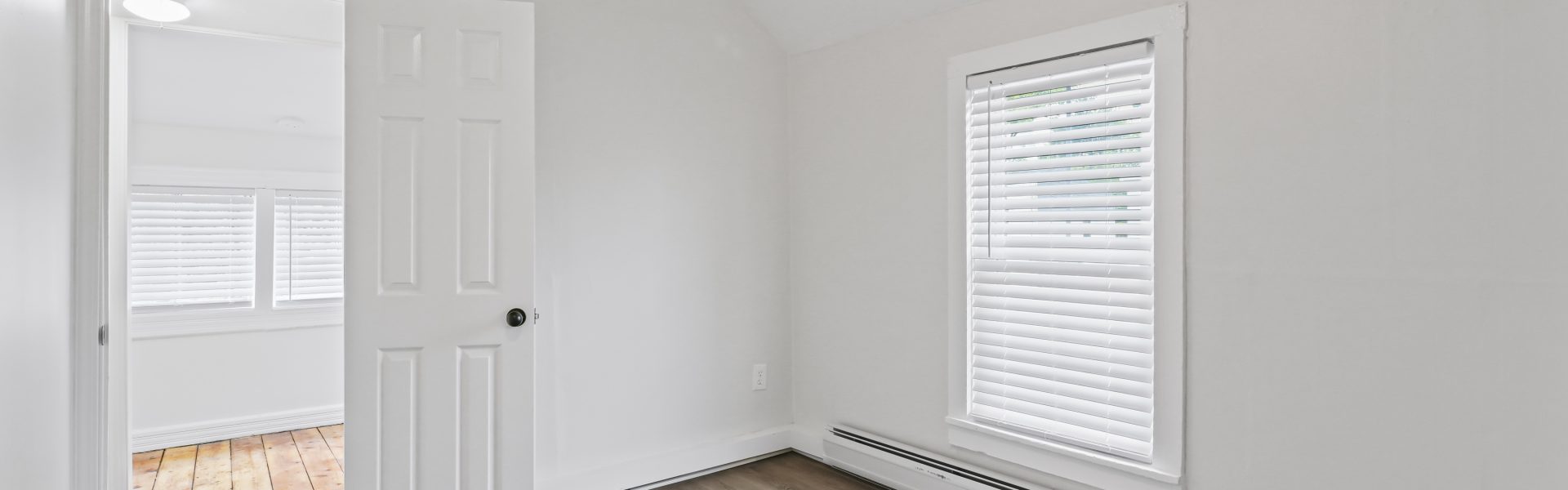 Interior view of a newly renovated 1-bedroom apartment at 2 New St #4 in South Glens Falls, NY, featuring updated flooring, modern finishes, and bright natural light.
