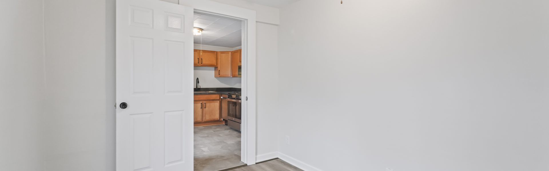 Interior view of a newly renovated 1-bedroom apartment at 2 New St #4 in South Glens Falls, NY, featuring updated flooring, modern finishes, and bright natural light.