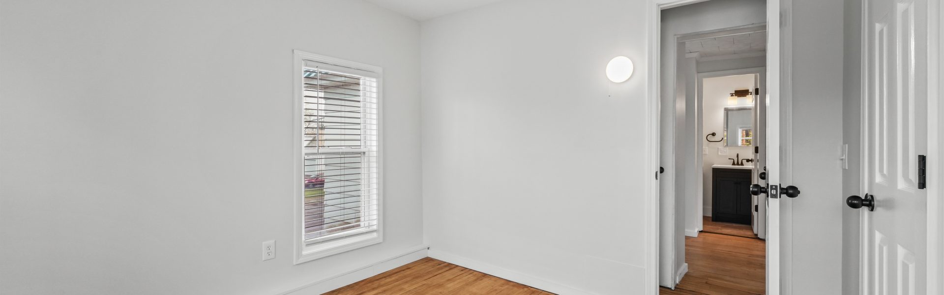 Interior view of a newly renovated 1-bedroom apartment at 35 Saratoga Ave #1 in South Glens Falls, NY, featuring modern finishes and bright natural light.