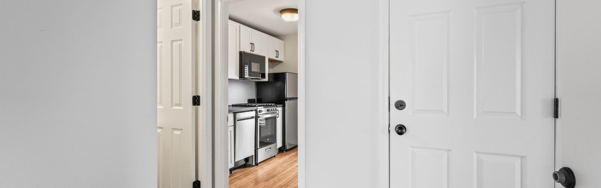 Interior view of a newly renovated 1-bedroom apartment at 35 Saratoga Ave #1 in South Glens Falls, NY, featuring modern finishes and bright natural light.
