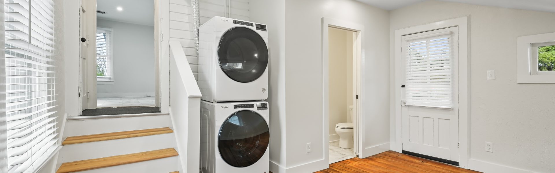 Interior view of a newly renovated 2-bedroom apartment at 58 Lincoln Ave #2 in Saratoga Springs, NY, featuring a balcony, dedicated office space, and modern finishes.