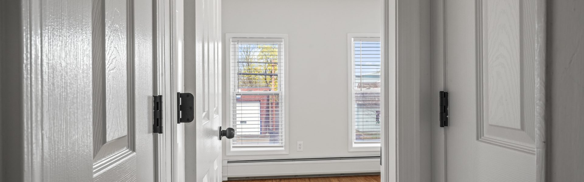 Interior view of a newly renovated 1-bedroom apartment at 35 Saratoga Ave #1 in South Glens Falls, NY, featuring modern finishes and bright natural light.