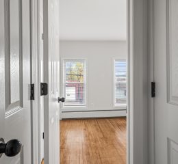 Interior view of a newly renovated 1-bedroom apartment at 35 Saratoga Ave #1 in South Glens Falls, NY, featuring modern finishes and bright natural light.