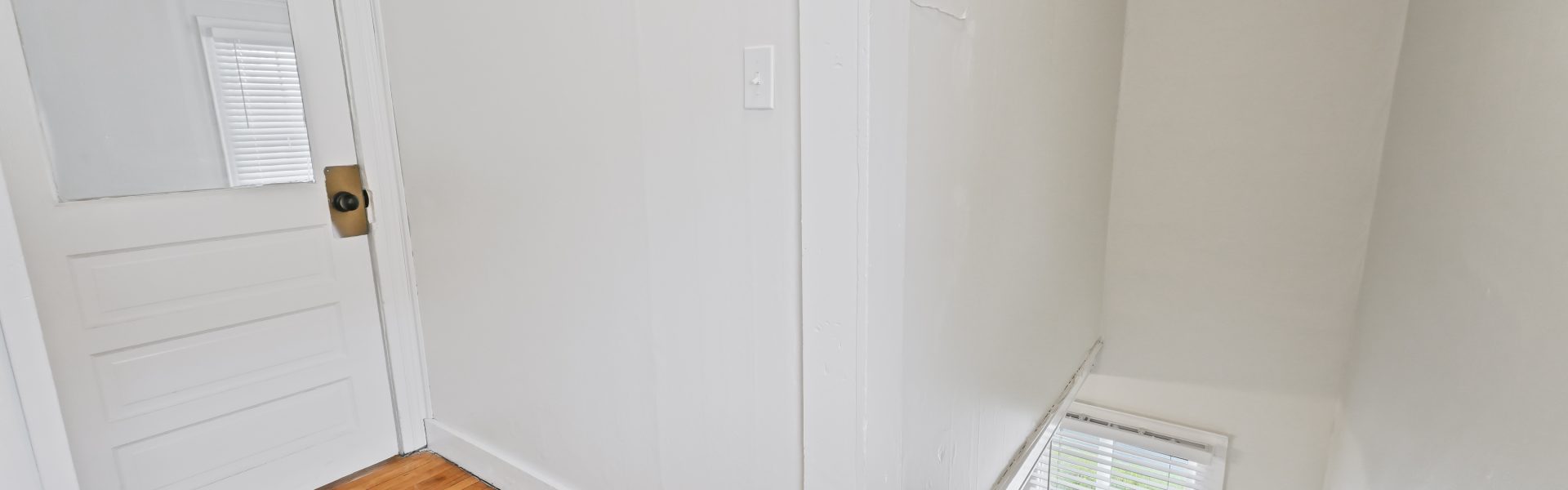 Interior view of a newly renovated 1-bedroom apartment at 2 New St #4 in South Glens Falls, NY, featuring updated flooring, modern finishes, and bright natural light.