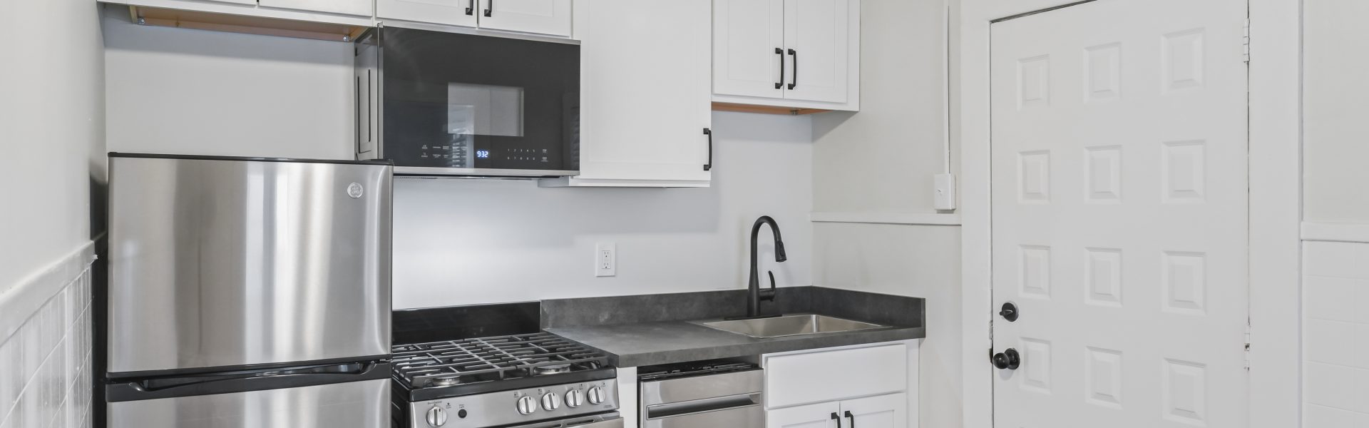 Interior view of a newly renovated 1-bedroom apartment at 2 New St #3 in South Glens Falls, NY with updated flooring and modern finishes.