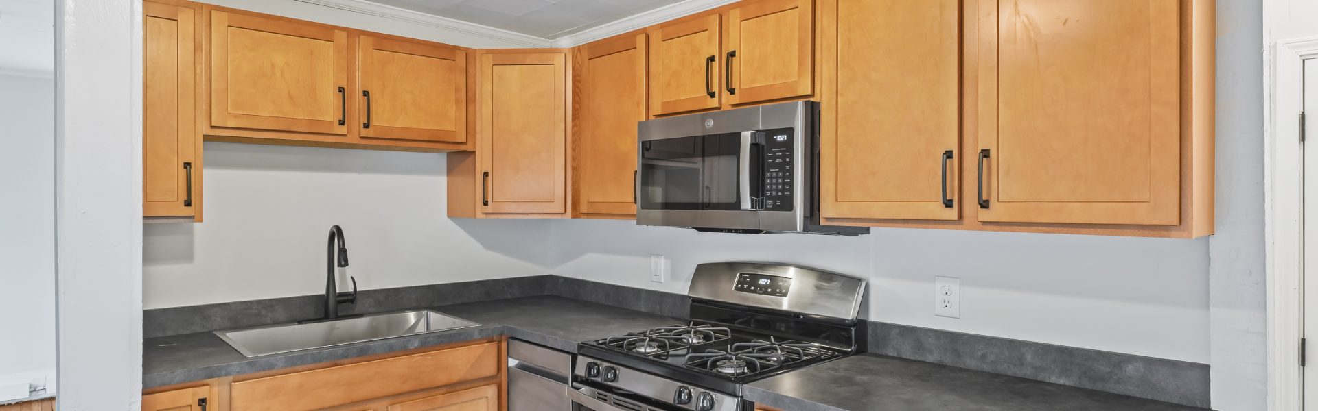 Interior view of a newly renovated 1-bedroom apartment at 2 New St #4 in South Glens Falls, NY, featuring updated flooring, modern finishes, and bright natural light.