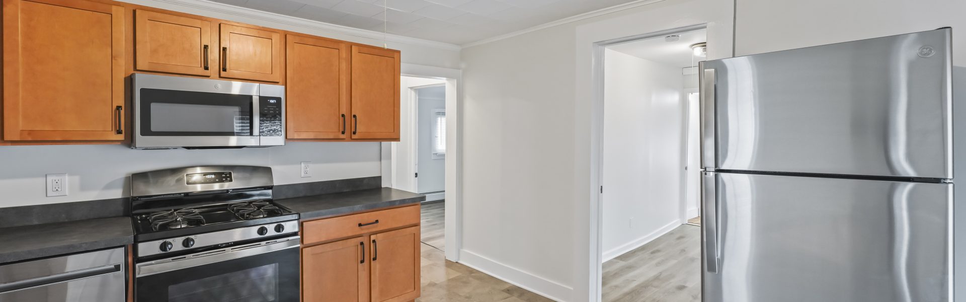 Interior view of a newly renovated 1-bedroom apartment at 2 New St #4 in South Glens Falls, NY, featuring updated flooring, modern finishes, and bright natural light.