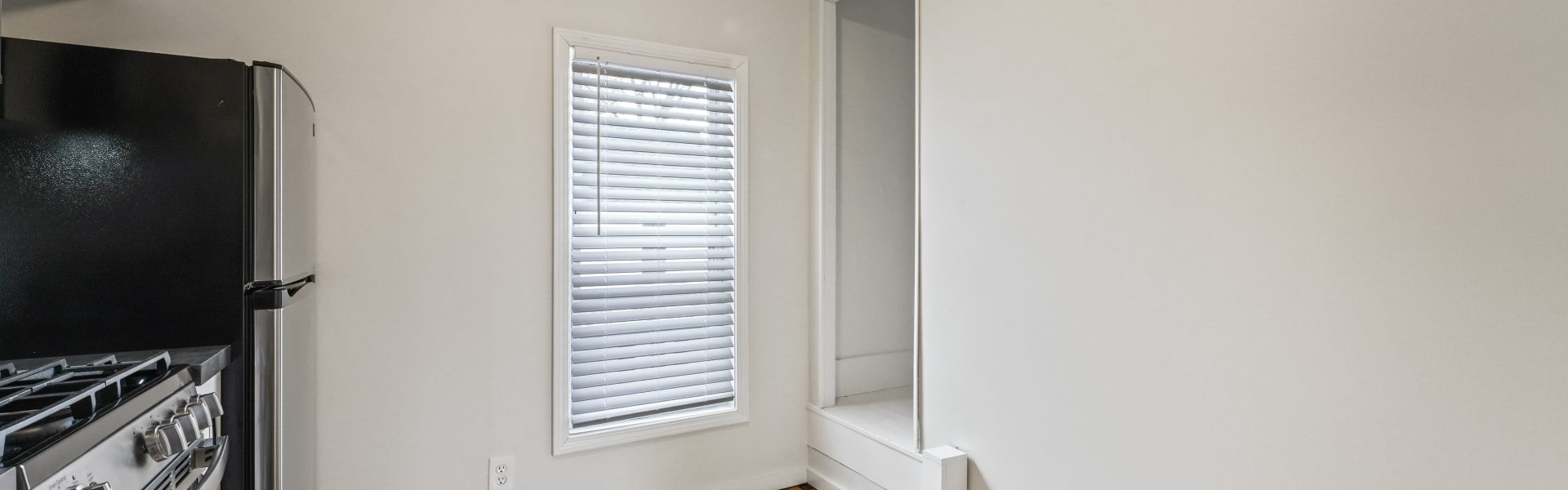 Interior view of a newly renovated 1-bedroom apartment at 35 Saratoga Ave #1 in South Glens Falls, NY, featuring modern finishes and bright natural light.