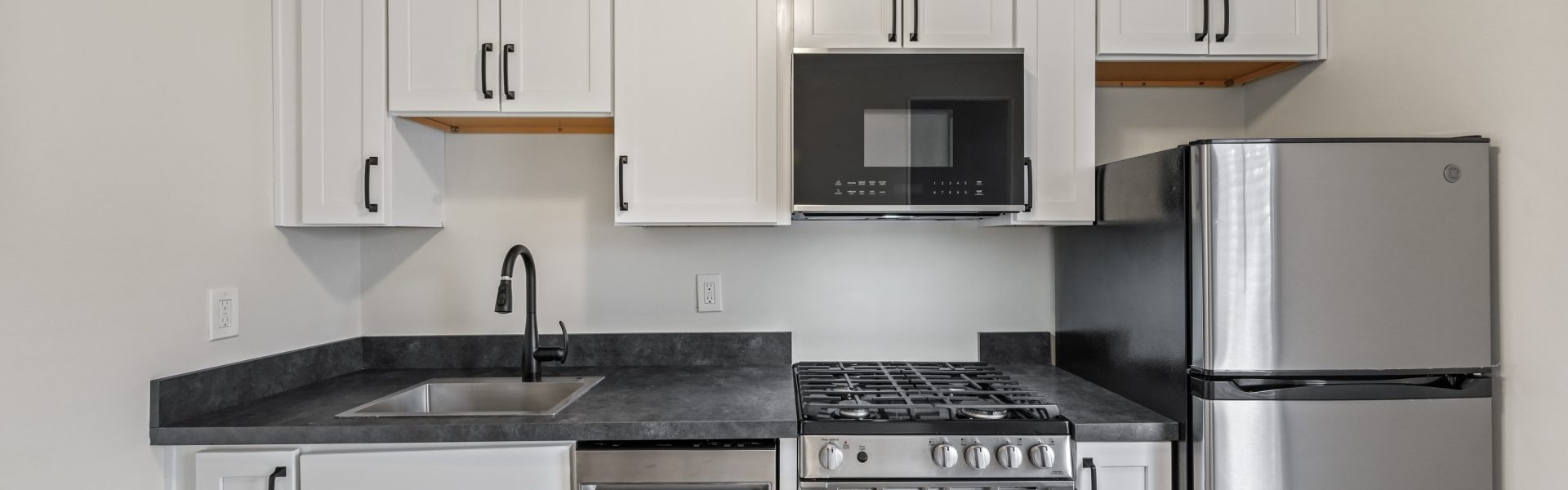 Interior view of a newly renovated 1-bedroom apartment at 35 Saratoga Ave #1 in South Glens Falls, NY, featuring modern finishes and bright natural light.