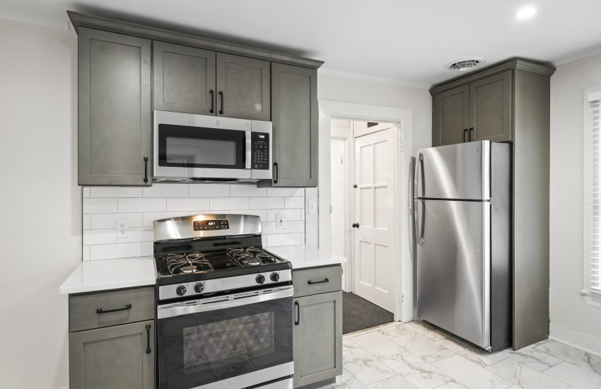 Interior view of a newly renovated 2-bedroom apartment at 58 Lincoln Ave #2 in Saratoga Springs, NY, featuring a balcony, dedicated office space, and modern finishes.