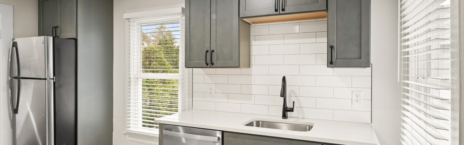 Interior view of a newly renovated 2-bedroom apartment at 58 Lincoln Ave #2 in Saratoga Springs, NY, featuring a balcony, dedicated office space, and modern finishes.