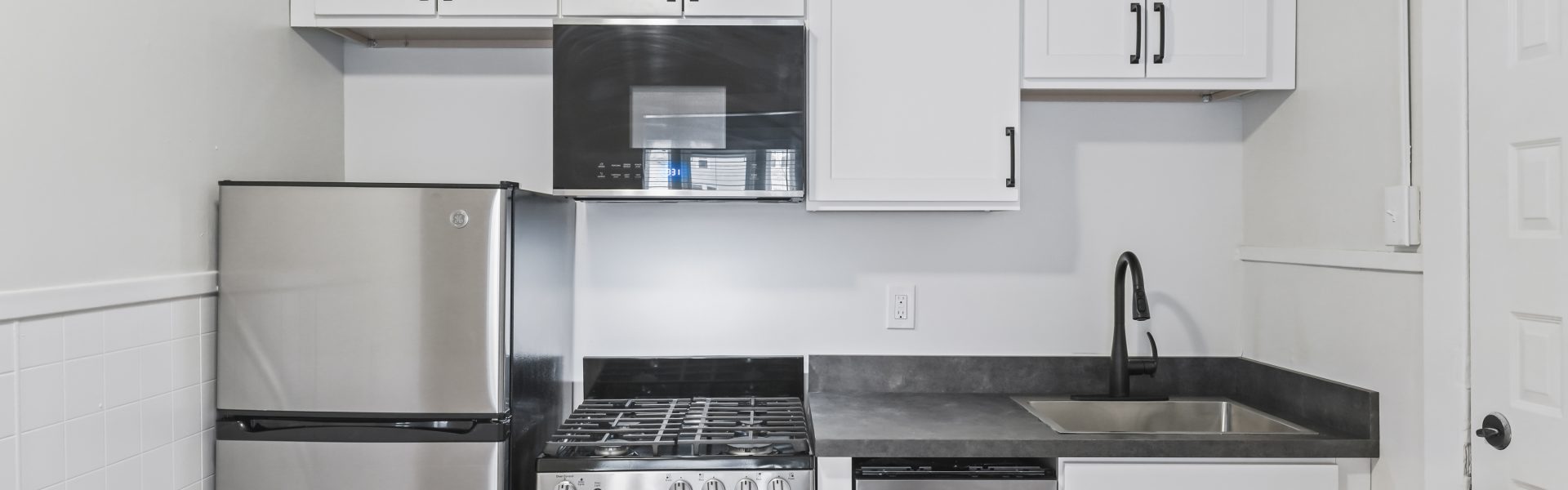 Interior view of a newly renovated 1-bedroom apartment at 2 New St #3 in South Glens Falls, NY with updated flooring and modern finishes.