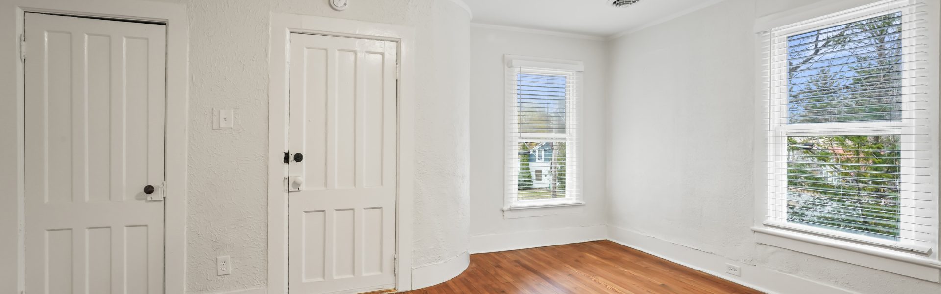 Interior view of a newly renovated 2-bedroom apartment at 58 Lincoln Ave #2 in Saratoga Springs, NY, featuring a balcony, dedicated office space, and modern finishes.