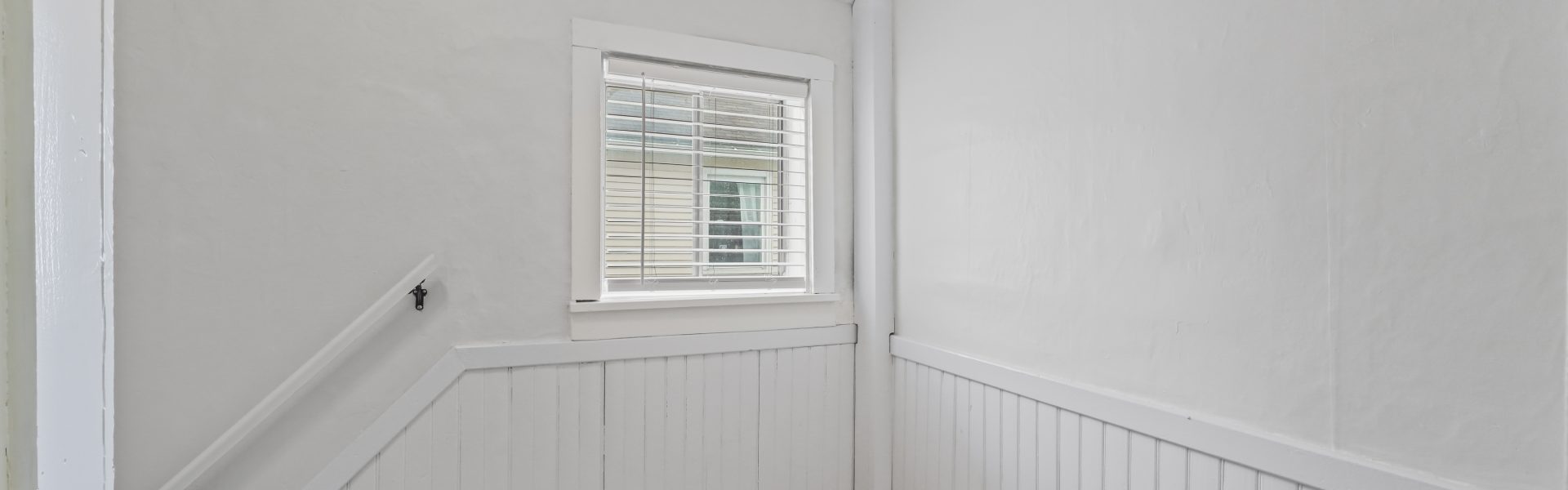 Interior view of a newly renovated 1-bedroom apartment at 2 New St #4 in South Glens Falls, NY, featuring updated flooring, modern finishes, and bright natural light.