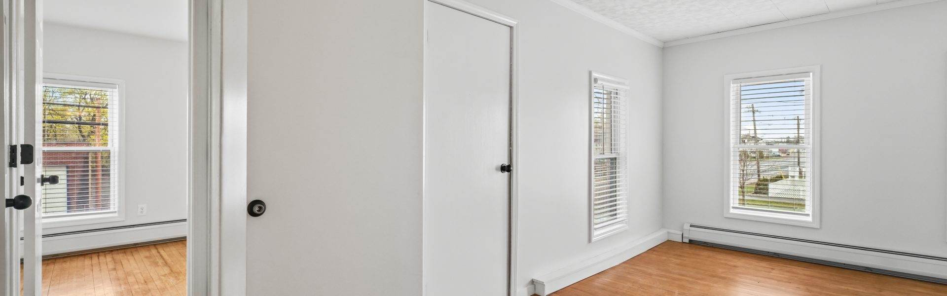 Interior view of a newly renovated 1-bedroom apartment at 35 Saratoga Ave #1 in South Glens Falls, NY, featuring modern finishes and bright natural light.
