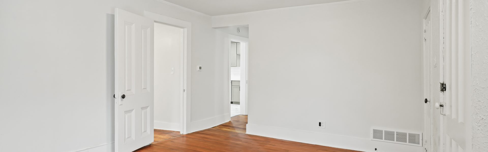 Interior view of a newly renovated 2-bedroom apartment at 58 Lincoln Ave #2 in Saratoga Springs, NY, featuring a balcony, dedicated office space, and modern finishes.