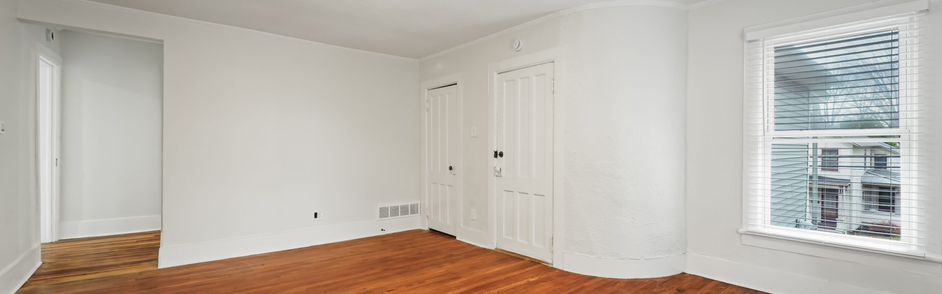 Interior view of a newly renovated 2-bedroom apartment at 58 Lincoln Ave #2 in Saratoga Springs, NY, featuring a balcony, dedicated office space, and modern finishes.