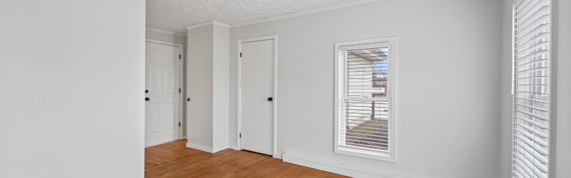 Interior view of a newly renovated 1-bedroom apartment at 35 Saratoga Ave #1 in South Glens Falls, NY, featuring modern finishes and bright natural light.